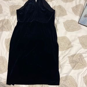 Blue velvet material form fitting dress with a slit lower left side. Hardly used